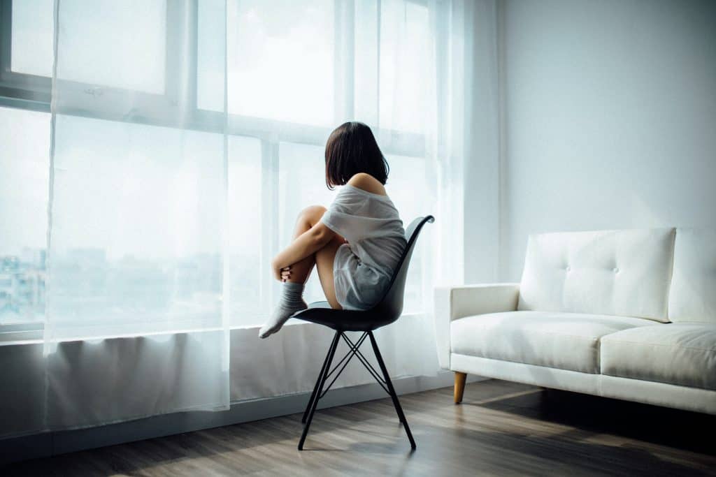 Daughter sitting on a chair.