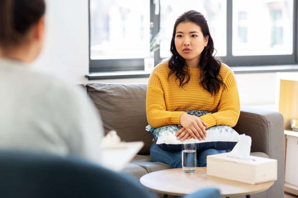 Woman receiving counseling in person.