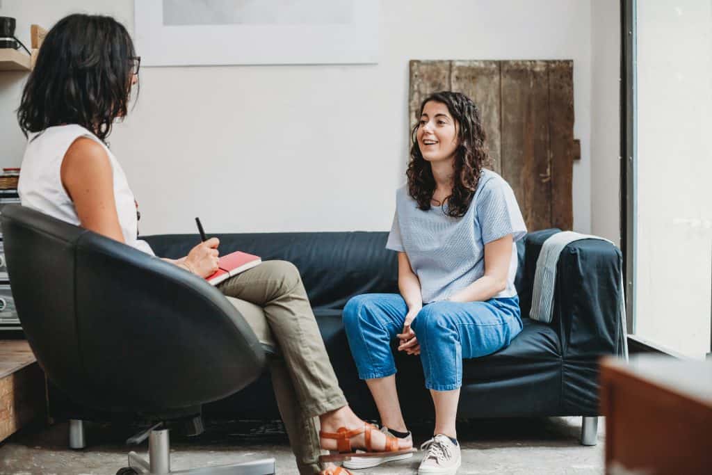 Woman receiving metaphysical counseling.