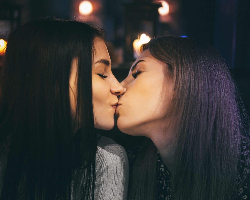 Lesbian couple kissing.