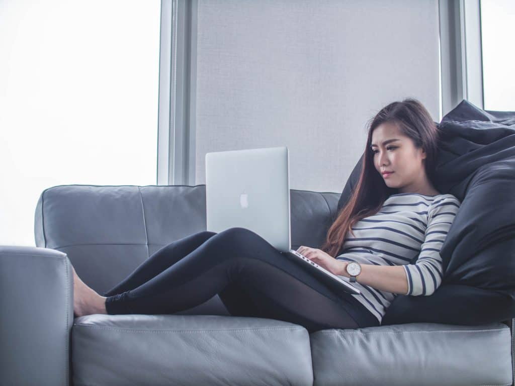 Woman receiving therapy on a computer.