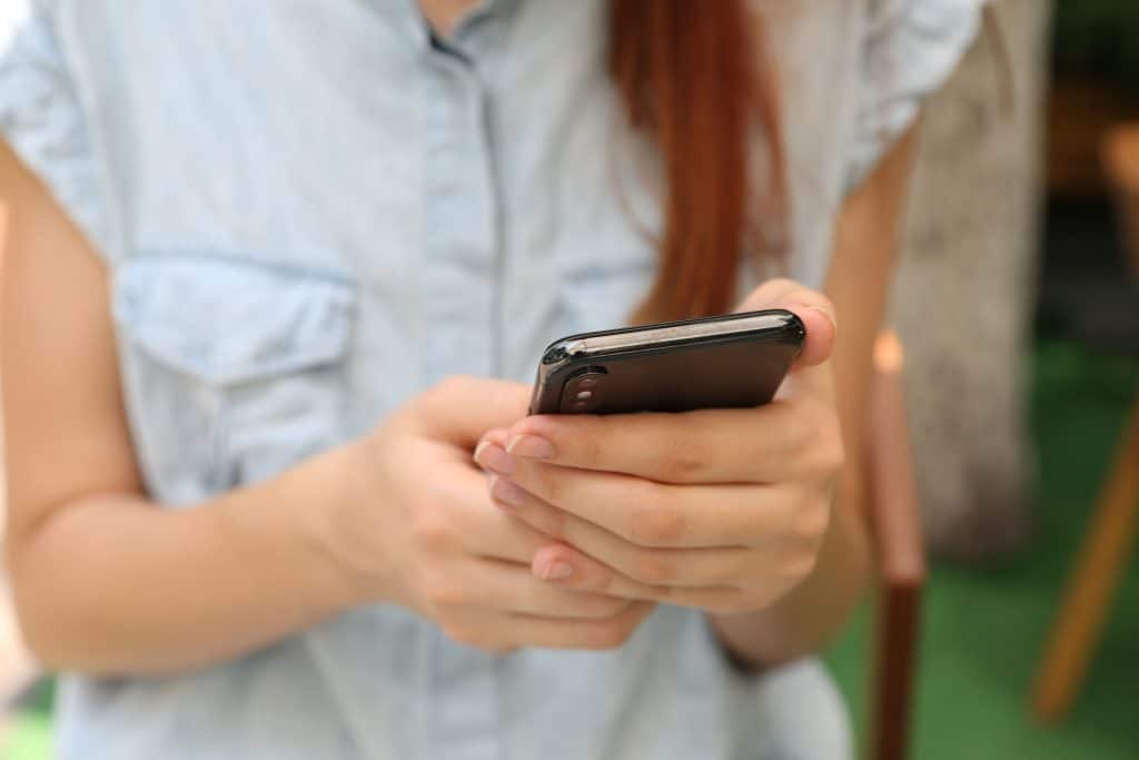 Woman receiving therapy on a phone.