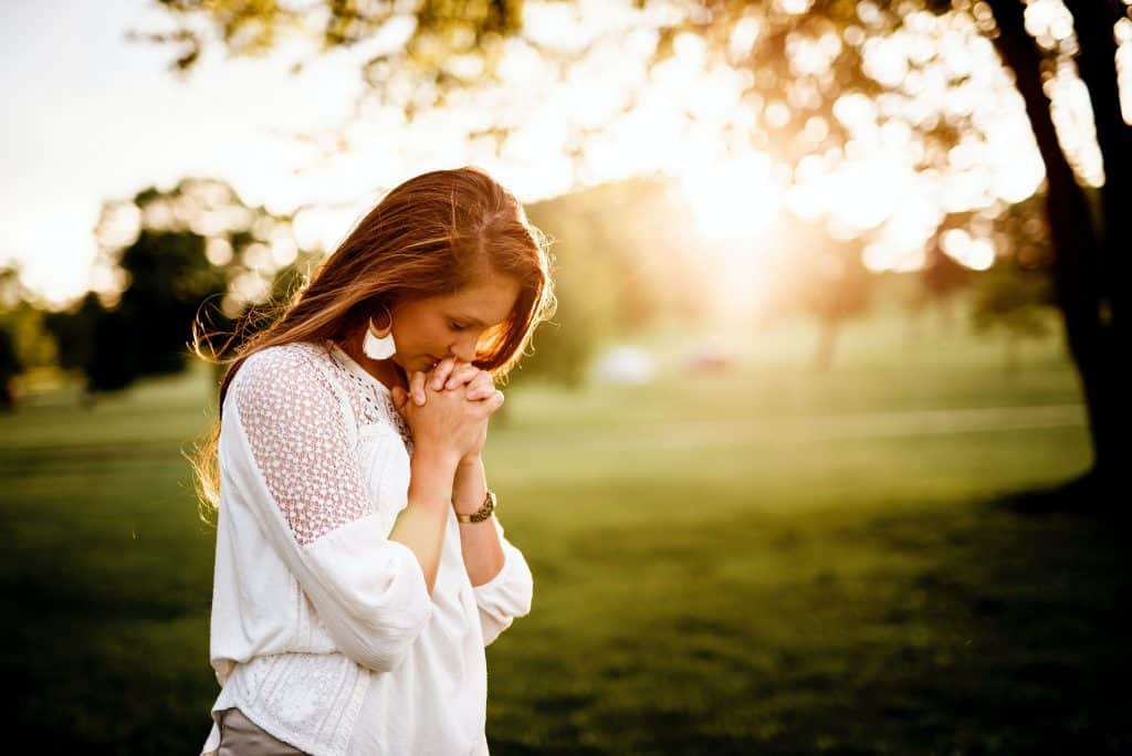 Woman praying to God.