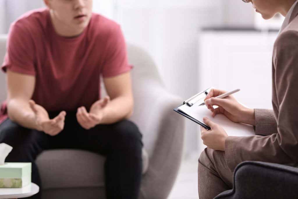 Teenager being open with a therapist.