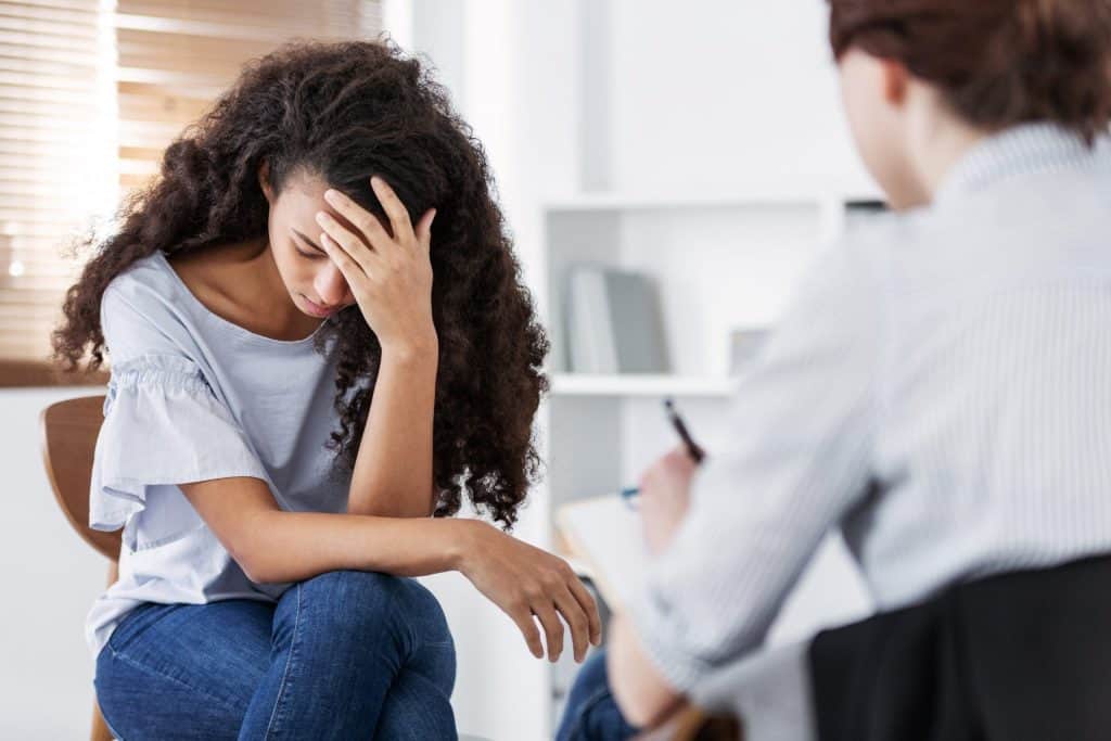 Woman seeing a therapist for help with skin picking.