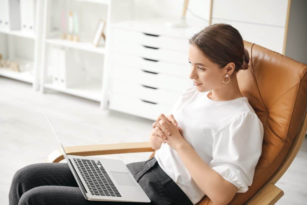 Counselor helping a patient over the internet.